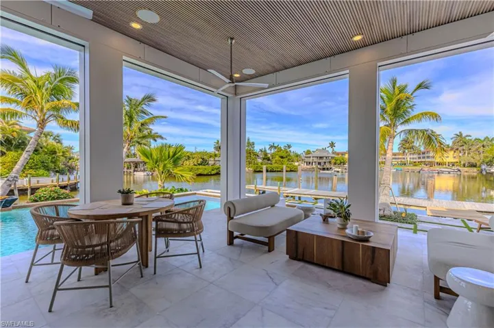 Sunroom with a healthy amount of sunlight bay views