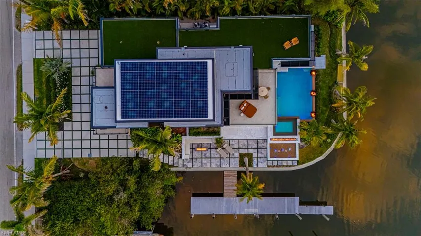 Aerial view including roof top sunrise and sunset green terrace and solar roof
