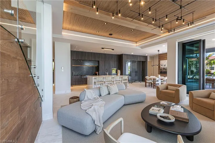 Soid raw American walnut complementing the leathered marble floors warming the living room