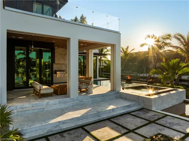 Patio terrace at with an outdoor fire pit and grilling area