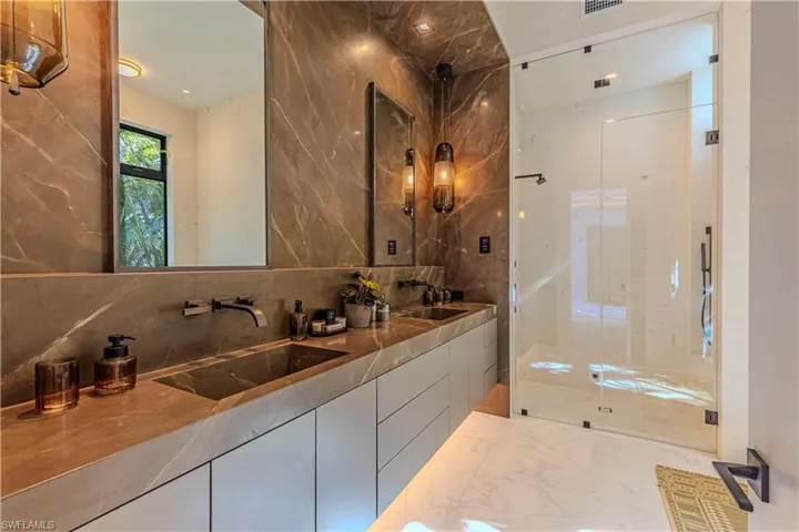 marble box master vanity with custom built sinks from 5 full slabs and steam shower