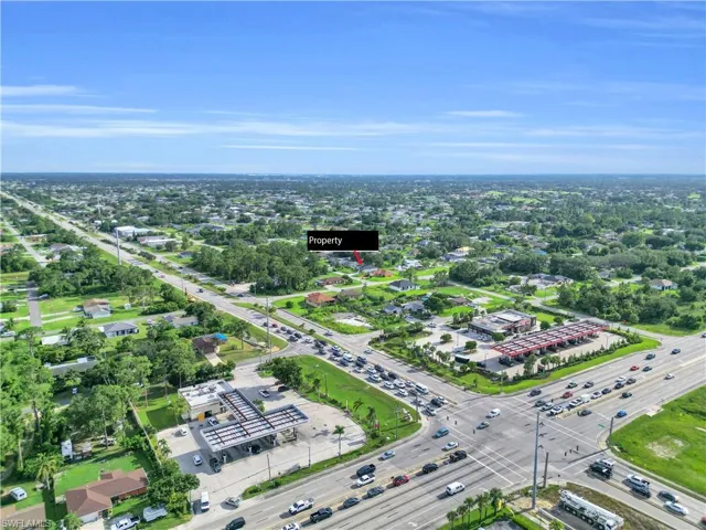 Aerial overview of property's location featuring a tree filled landscape