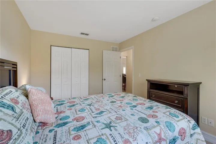 Bedroom with a closet and baseboards