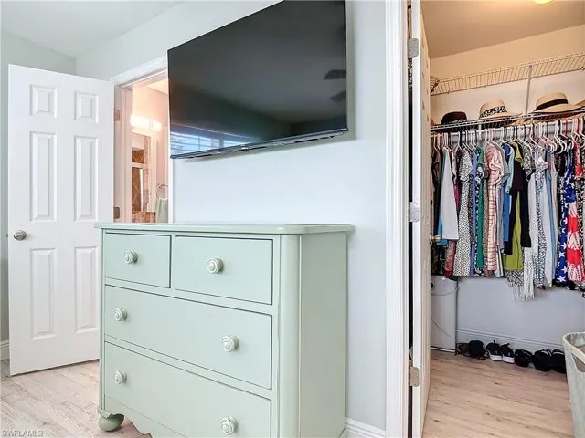 Primary bedroom with walk-in closet ad private bathroom