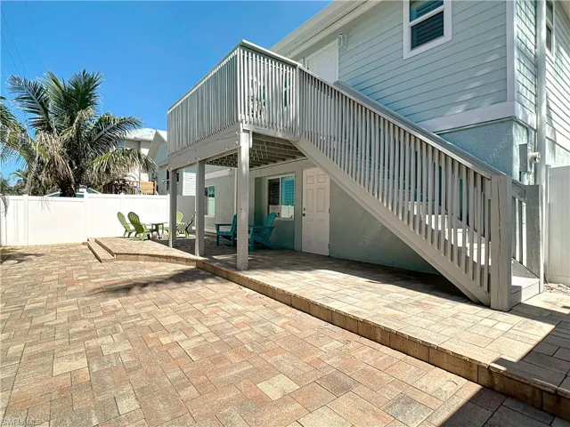Rear view of property featuring a patio area
