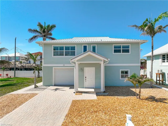 View of front entry and garage