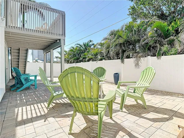 View of patio with a balcony