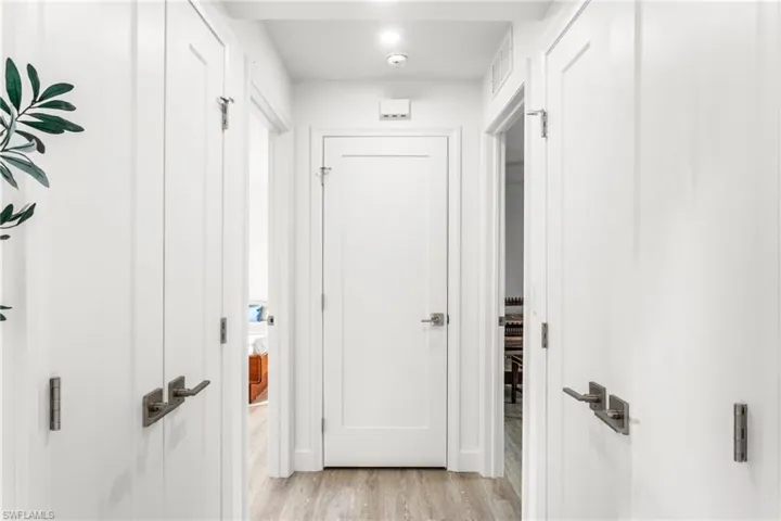 Hallway with light wood finished floors