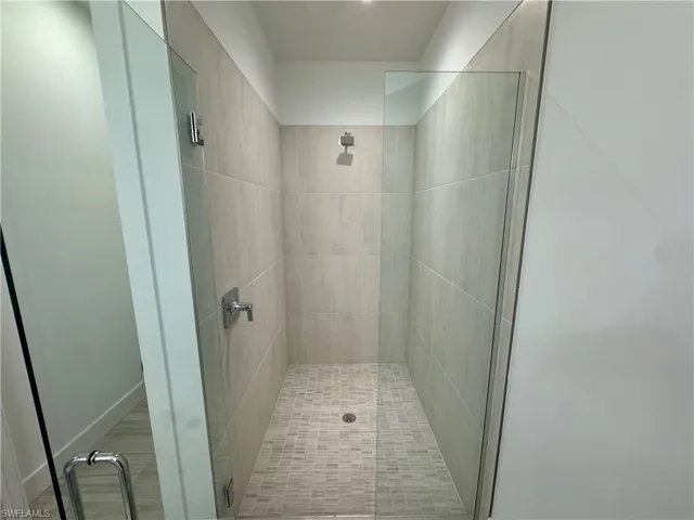 Luxe, walk-in shower with beautiful shower floor and wall tile