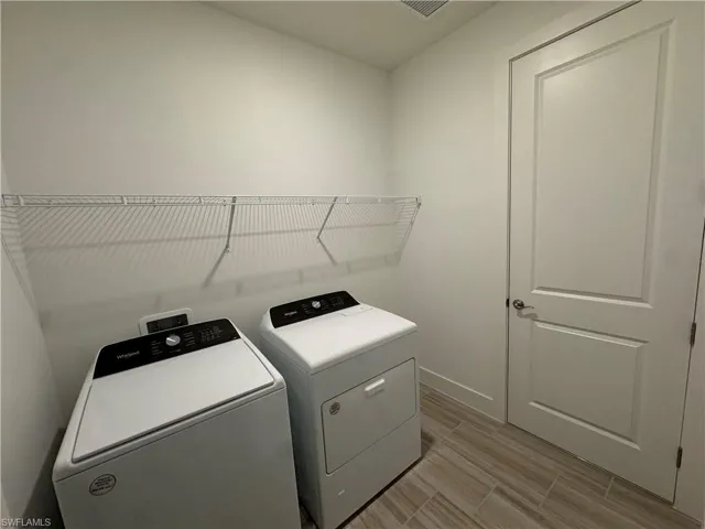 Laundry room with Whirlpool washer and gas dryer