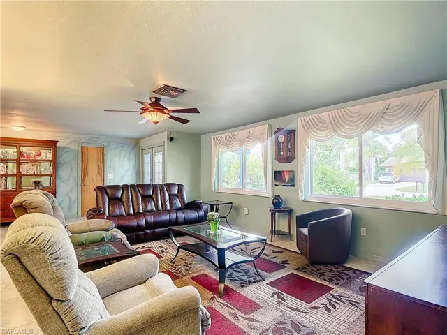 Living room featuring ceiling fan