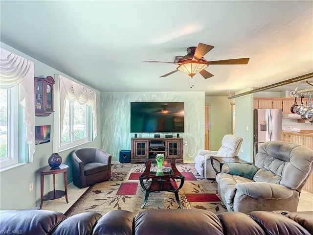 Living room featuring ceiling fan