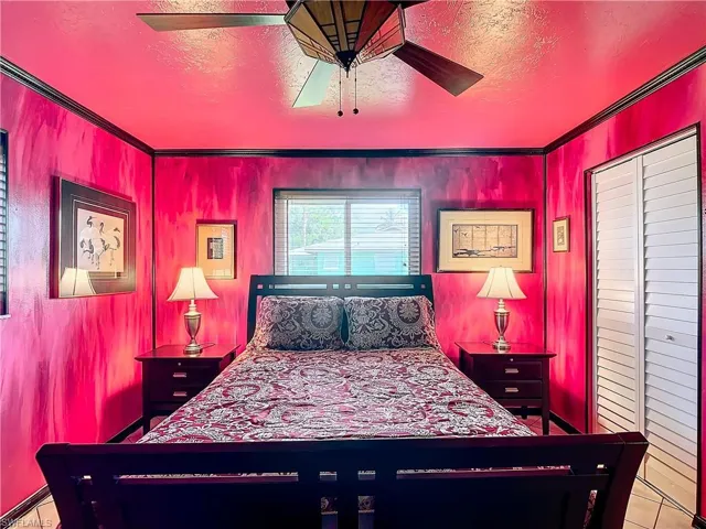 Bedroom featuring a baseboard radiator and ceiling fan