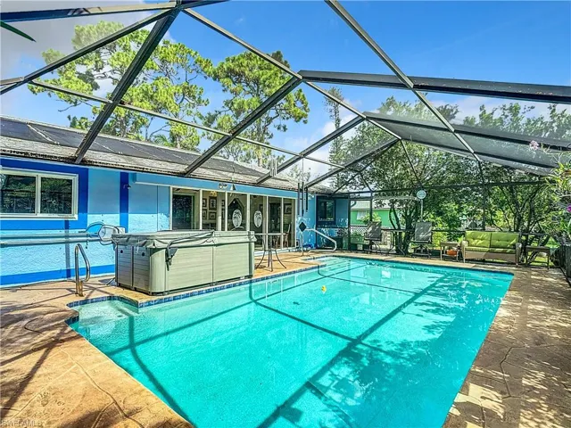 View of pool featuring a lanai