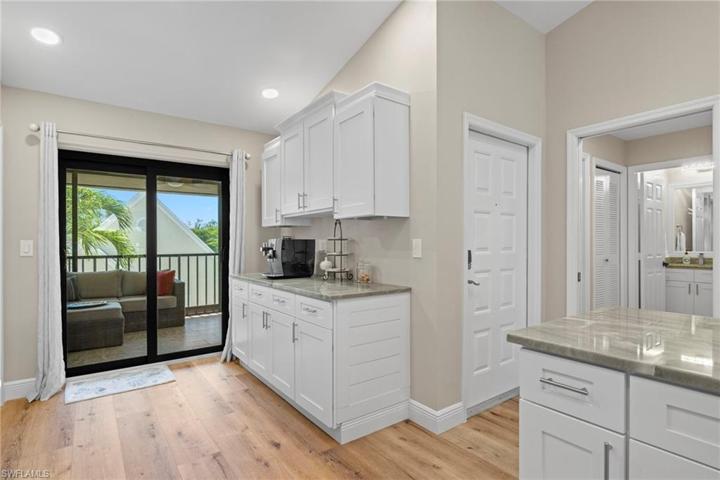 Kitchen view towards front door and guest suite