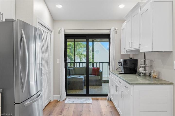 Coffee bar with pantry, abundant storage and impact sliders to the entrance lanai