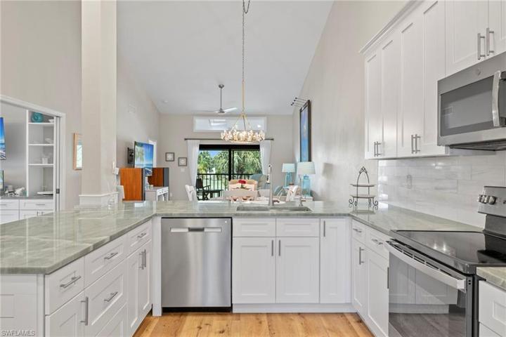 Spacious, redesigned kitchen with shaker cabinets and stainless appliances