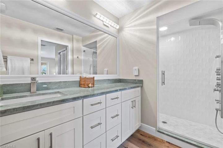Master bath with large shower and premium fixtures
