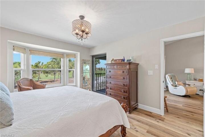 Master bedroom with impact slider to golf course facing lanai