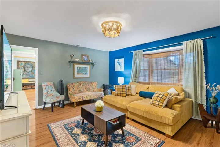 Living room with hardwood / wood-style flooring
