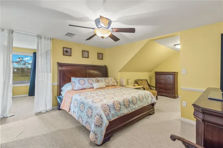 Bedroom with carpet flooring and ceiling fan