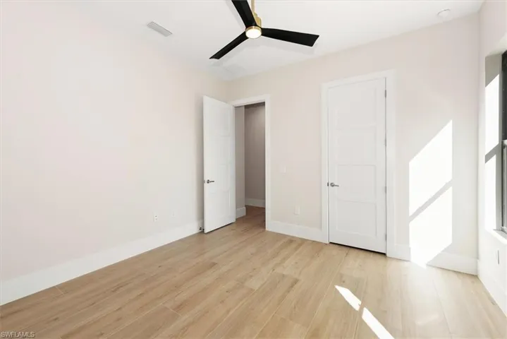 Unfurnished bedroom with light wood-style flooring and a ceiling fan
