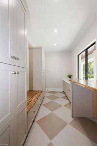 Mudroom with recessed lighting and light floors