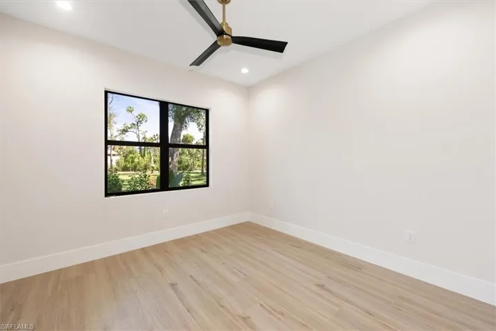 Spare room with light wood finished floors, recessed lighting, and ceiling fan
