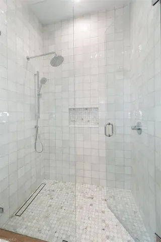 Bathroom featuring a shower stall