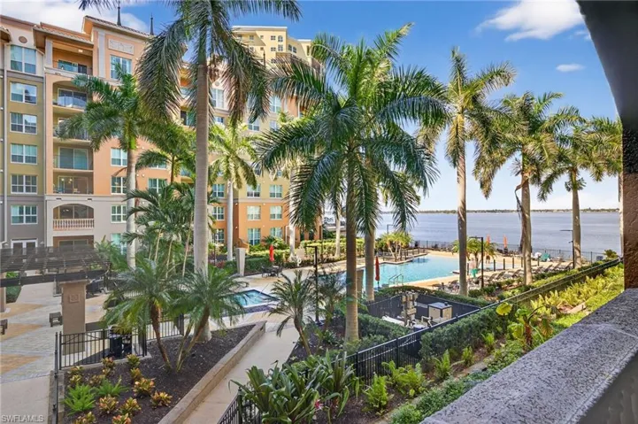 Community pool featuring a water view