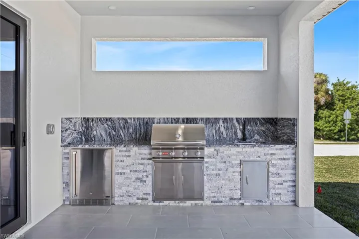 View of patio with area for grilling