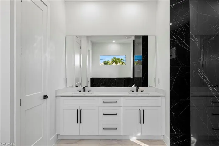 Bathroom with vanity and walk in shower