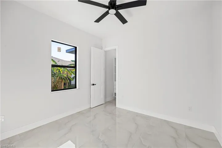 Spare room featuring ceiling fan