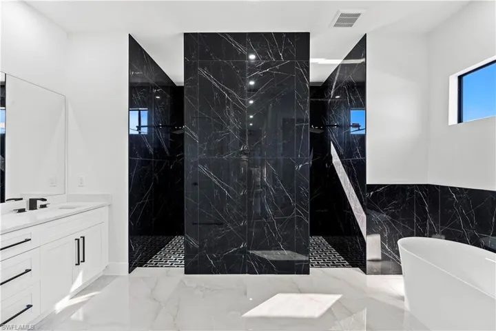 Bathroom with vanity and independent shower and bath