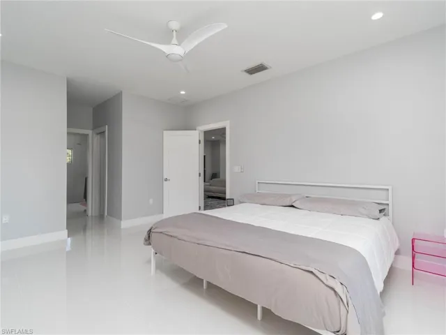 Bedroom featuring light tile patterned floors, recessed lighting, and a ceiling fan