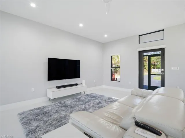 Living room featuring recessed lighting and baseboards