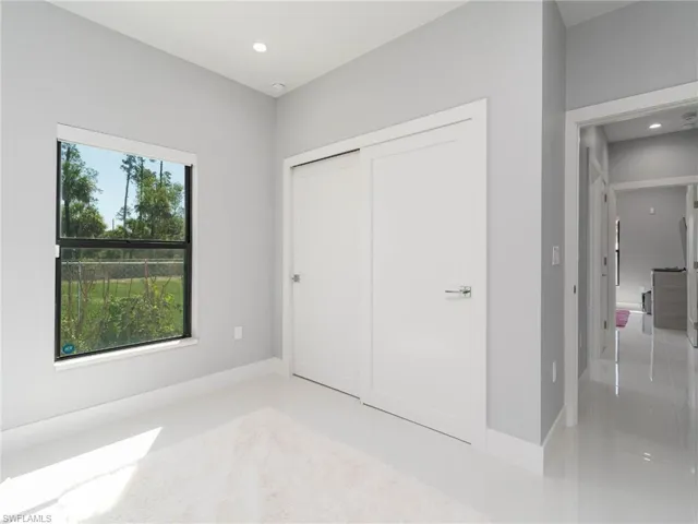 Unfurnished bedroom featuring recessed lighting and a closet