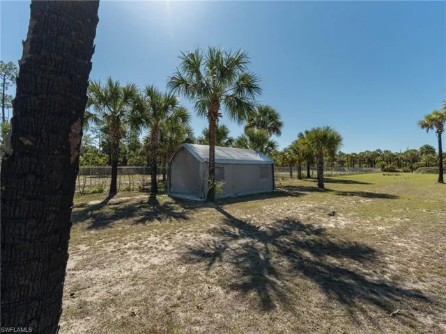 View of yard featuring a portable storage shed