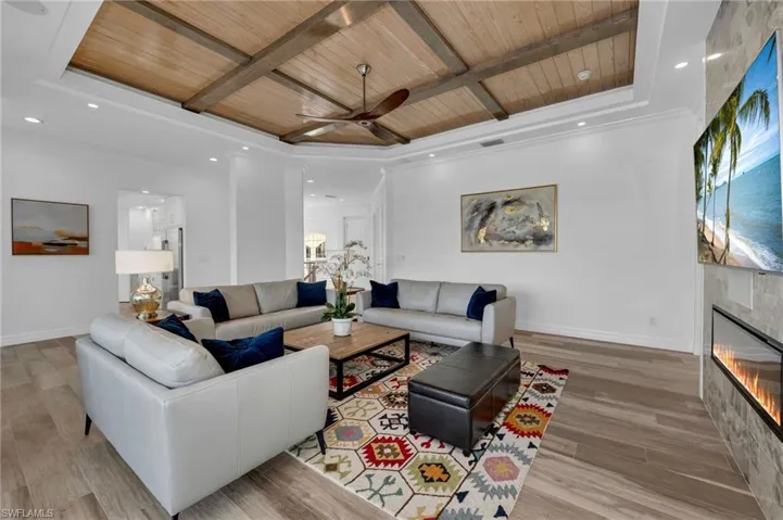 The family room has Dolby surround sound home theater system, topped off with ambient oak-beamed ceiling...