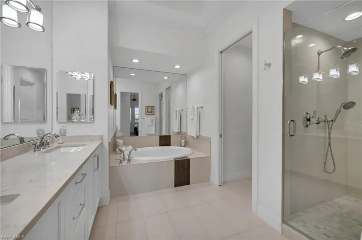 Completely remodeled Primary Bath with large, walk-in shower and beautiful, contemporary design.