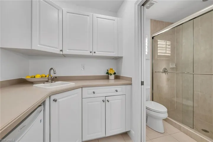 Cabana has kitchenette with sink and refrigerator.