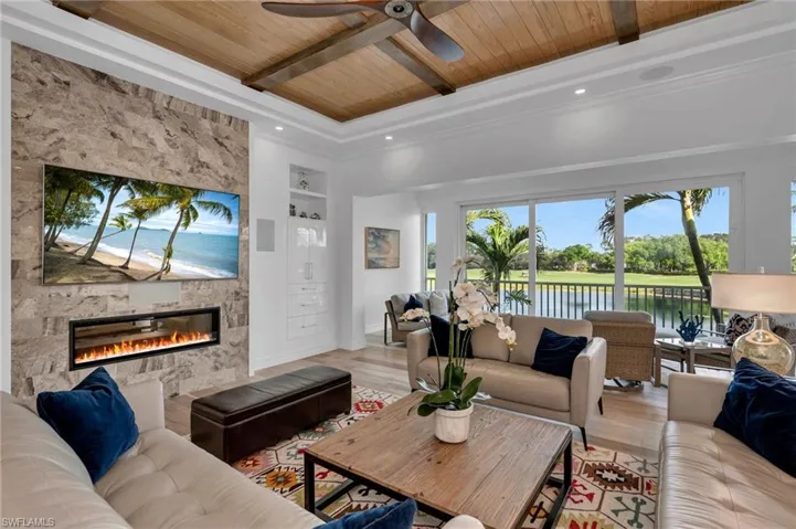 The family room boasts of oak-beamed ceilings, Dolby surround sound home theater system, cozy fireplace and incredible views to the golf course...