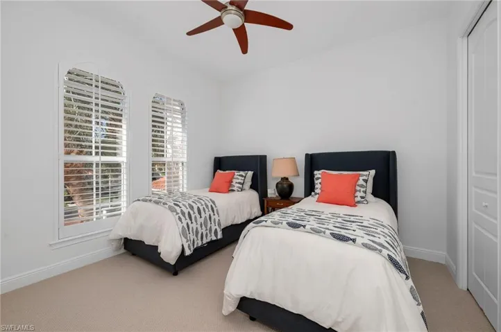 Guest bedroom with new carpeting newly-installed.