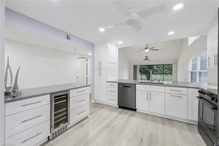 Open Air Design with Peninsula Island with Pull Outs to Also Include a Wine or Beverage Cooler