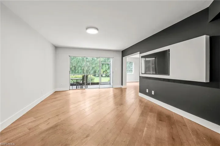 Spare room featuring light wood-type flooring