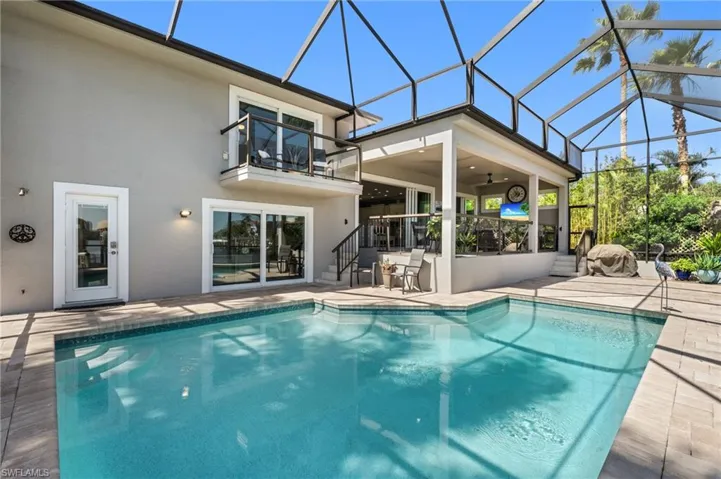 Glass Railings, Screened Lanai, Pool overlooking Bay Waters