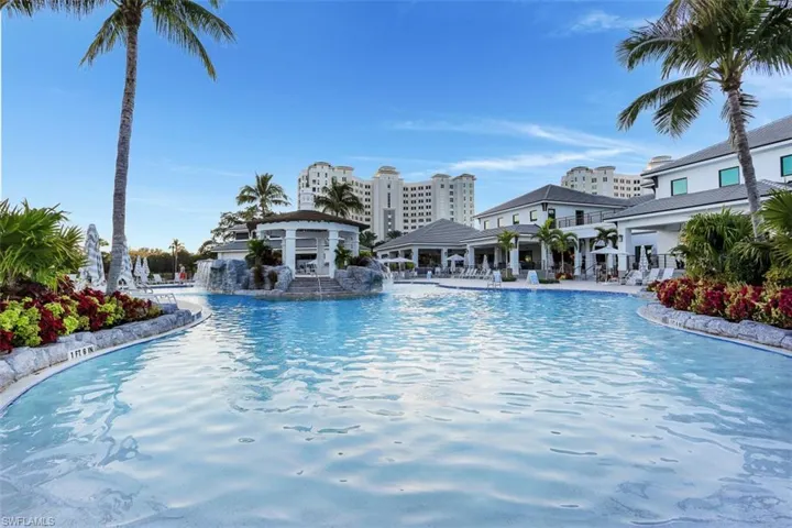Community pool with a patio
