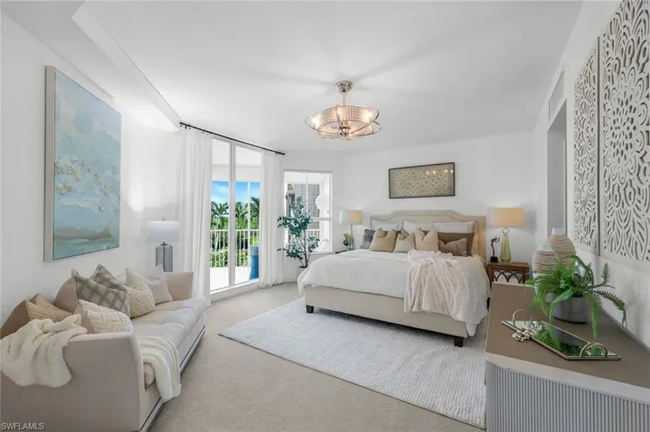 Bedroom featuring carpet floors and access to exterior