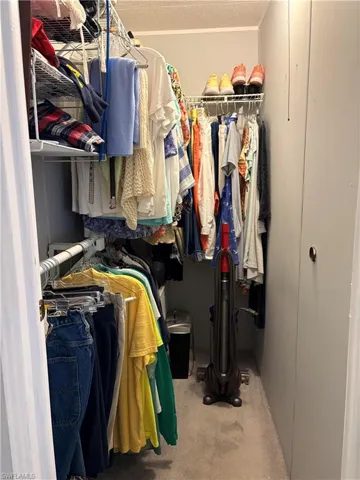 Bedroom featuring a closet and carpet flooring