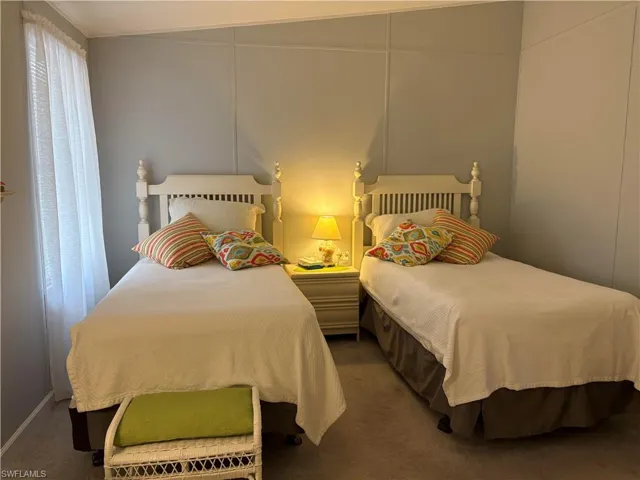 Bedroom with dark carpet